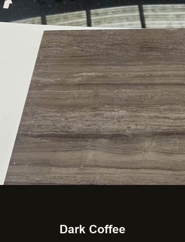 A cut sample of the dark coffee board: a warm deep brown with straight parallel darker veins running across it, photographed on a white bench.