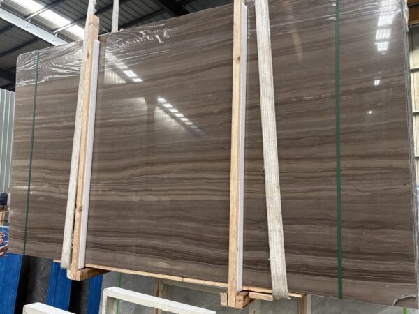 Two slabs banded together in a timber frame, the figures not quite matching, which is the reason the banding is done by hand.