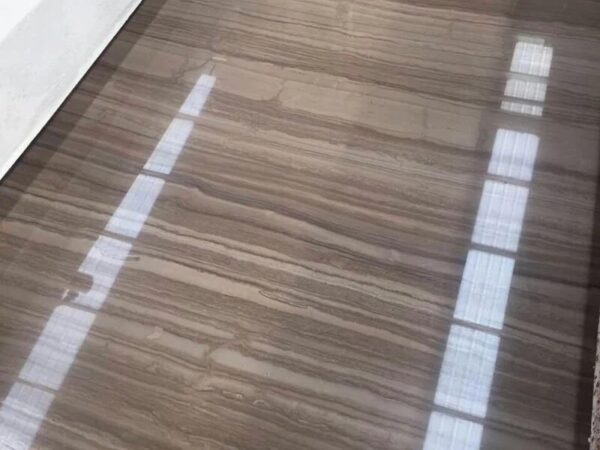 The same face after honing, matte rather than mirror, and the figure reading wider and flatter.