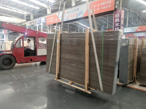 A full container of slabs in the yard, banded and strapped, ready to be closed up.