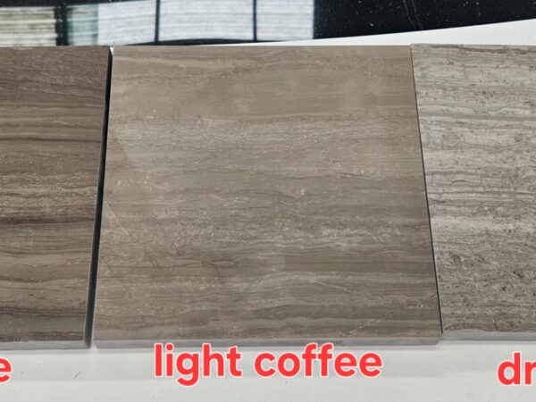 Three polished stone pieces laid side by side on a white surface, labelled dark coffee, light coffee and dark grey